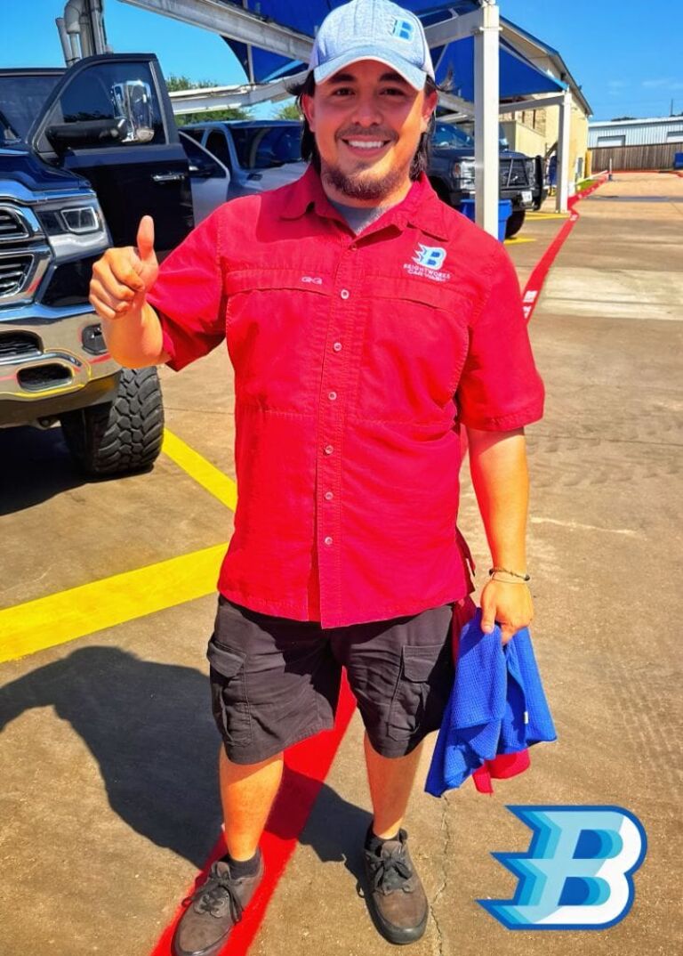 Brightworks Granbury on-site manager giving a thumbs up at the car wash